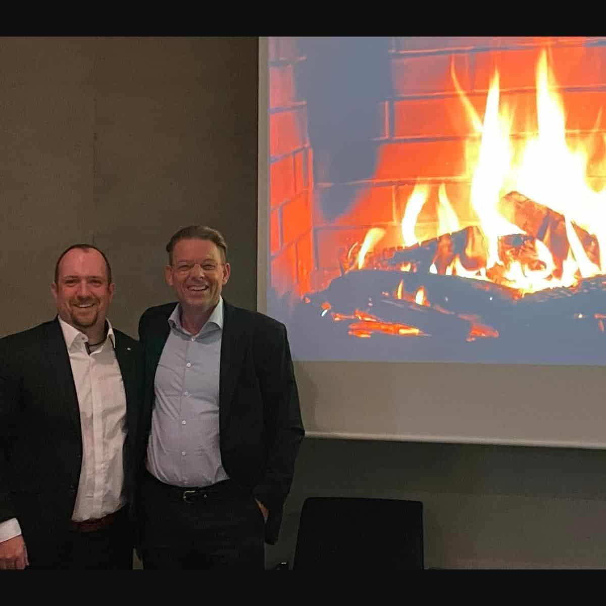 Andreas Lau and Ingo Pautsch in front of the fireplace