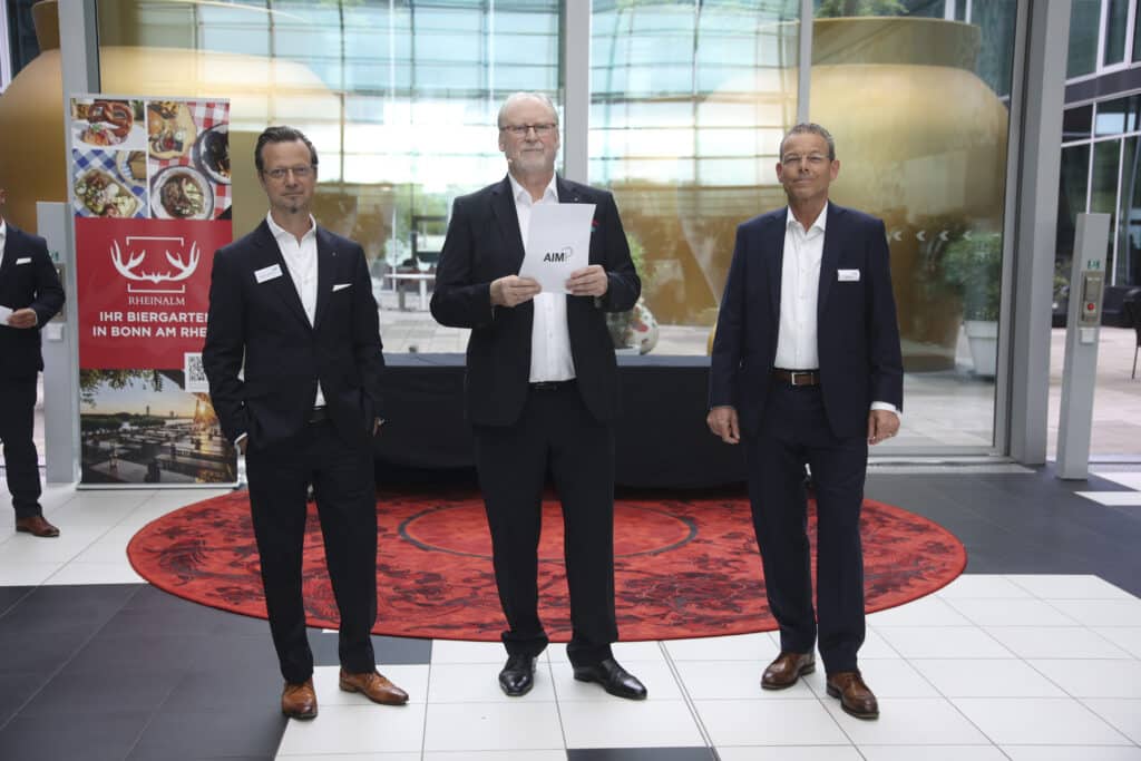 AIMP Vorstand Dr. Ludwig Mayr, Dr. Bodo Blanke und Andreas Lau bei der Eröffnungsrede